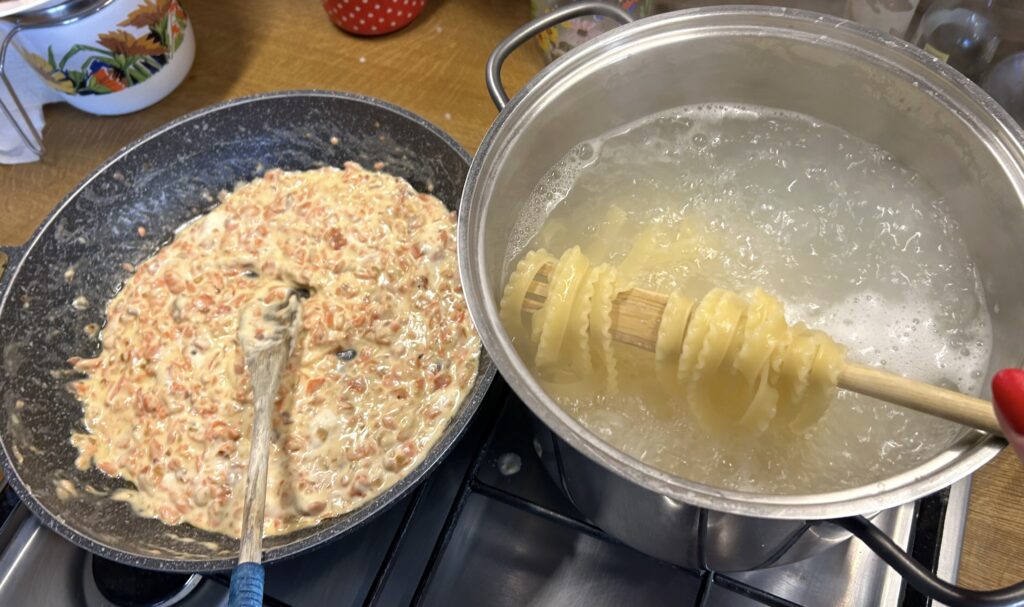 add 3 tablespoons of the pasta cooking water