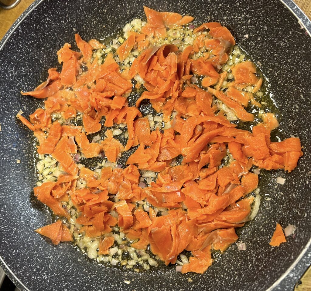 fry smoked salmon in onion