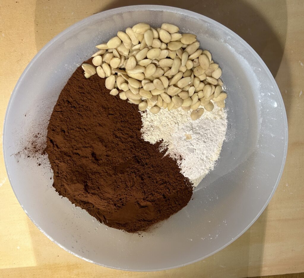 mix pitted almonds, flour, bitter cocoa, yeast