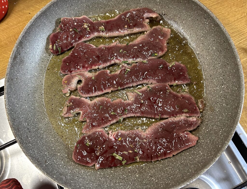 cooked meat around the steaks