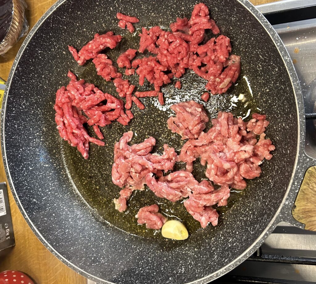 garlic and add the minced pork and the minced beef