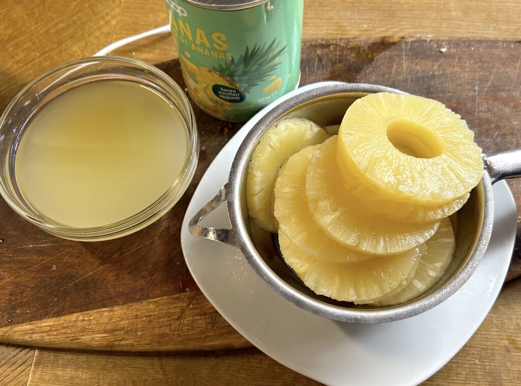 take the pineapple slices out of the can