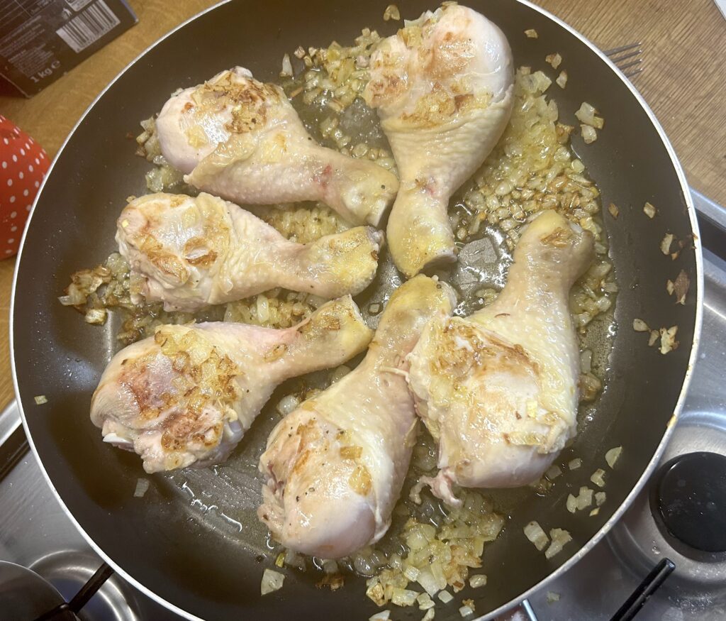 add the chicken legs to the pan