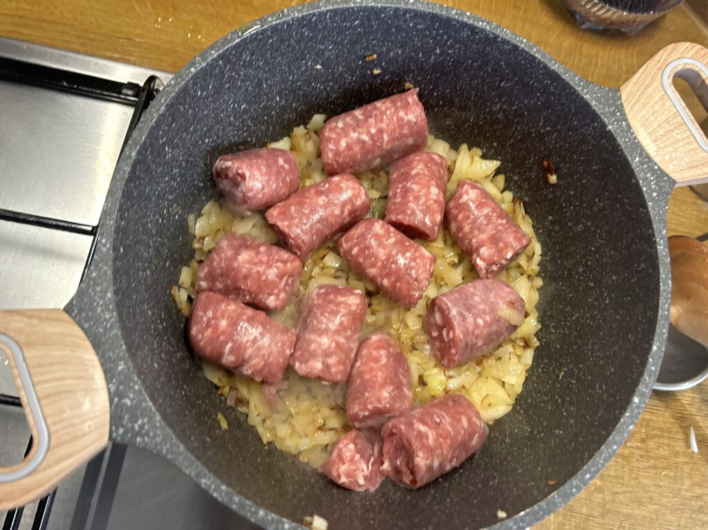 add the pieces of sausage