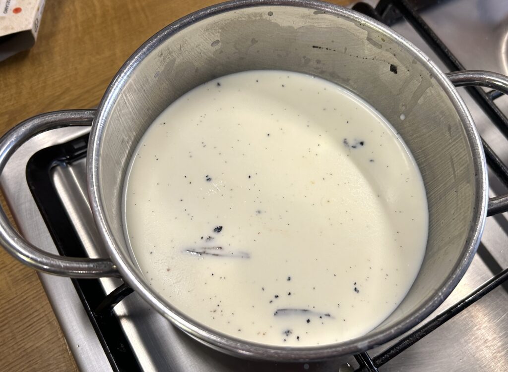 milk, cream and the seeds scraped from the vanilla