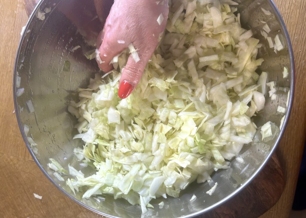 salt and rub the cabbage