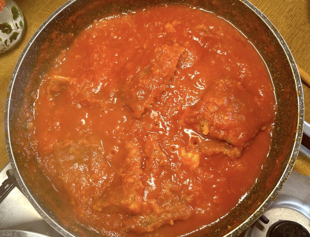 add tomato puree and wine