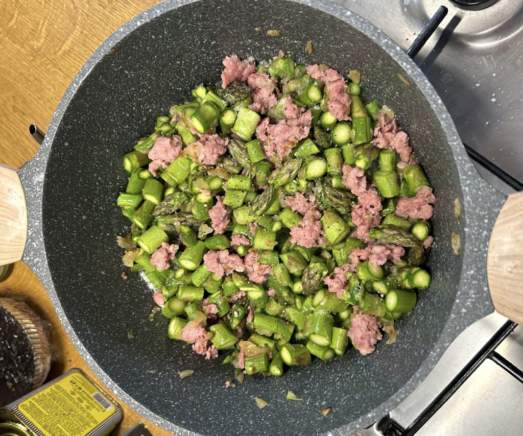 asparagus on top of the salami mixture