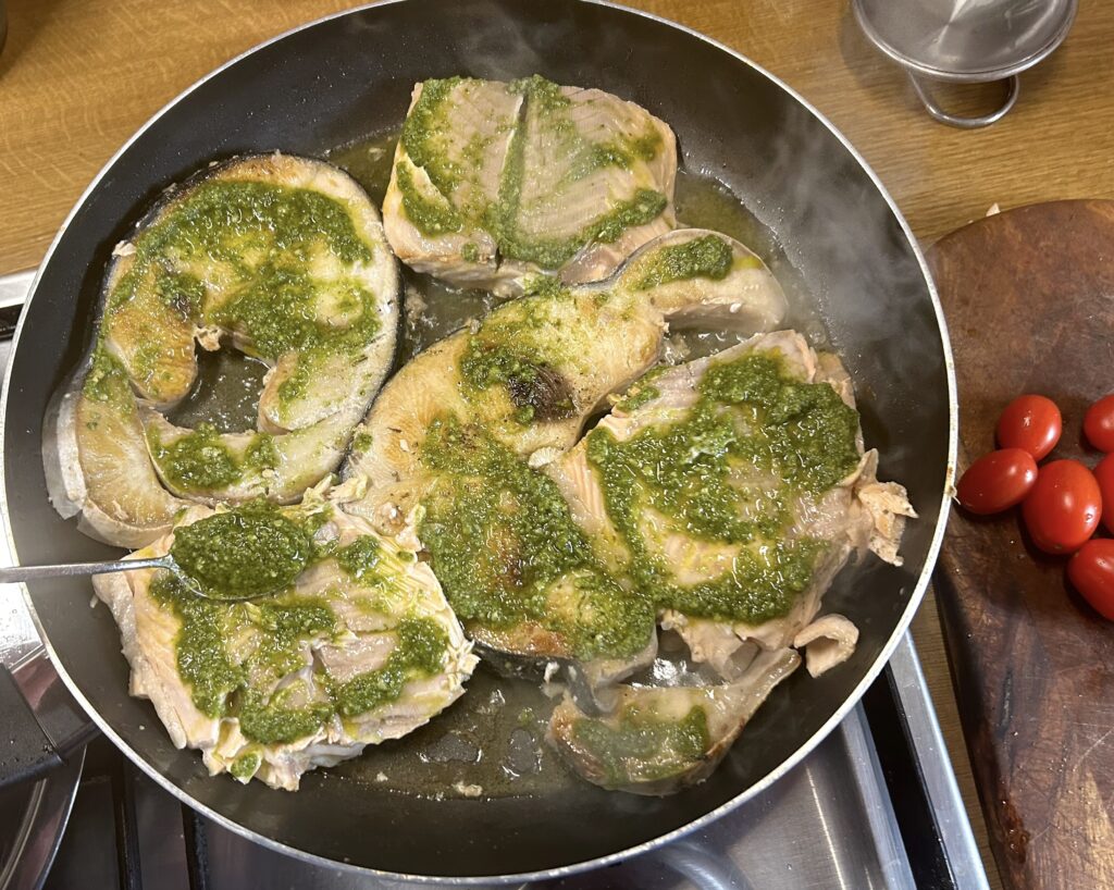 fish steaks spread with Genoese pesto