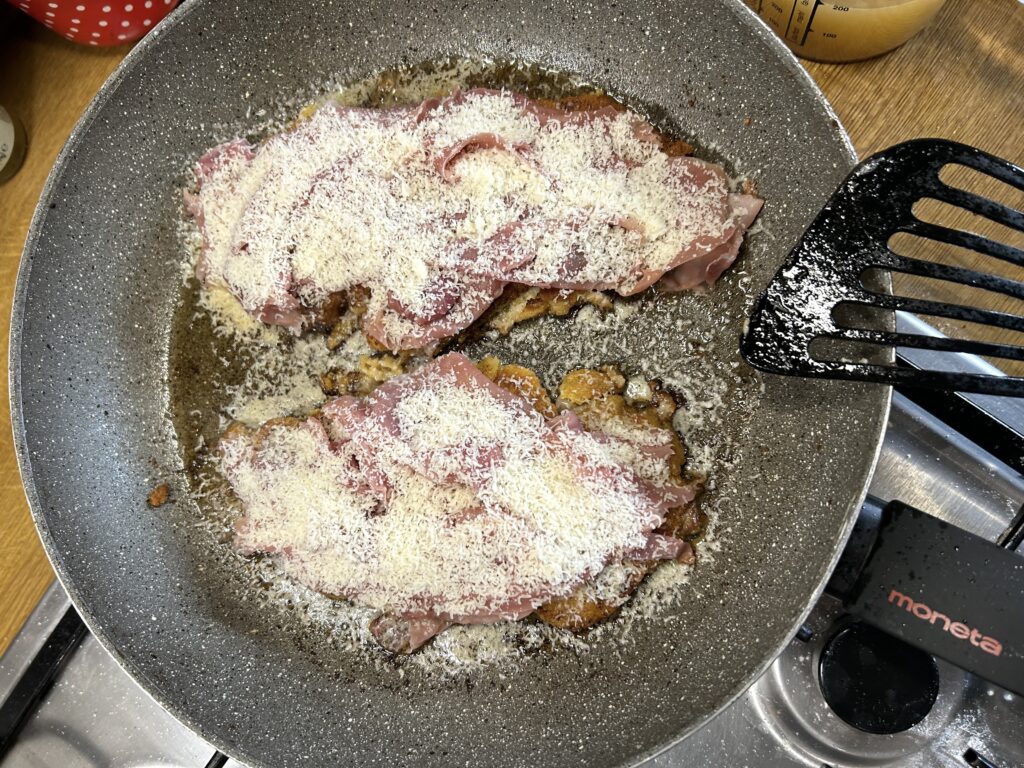 add the Parmesan over the raw ham