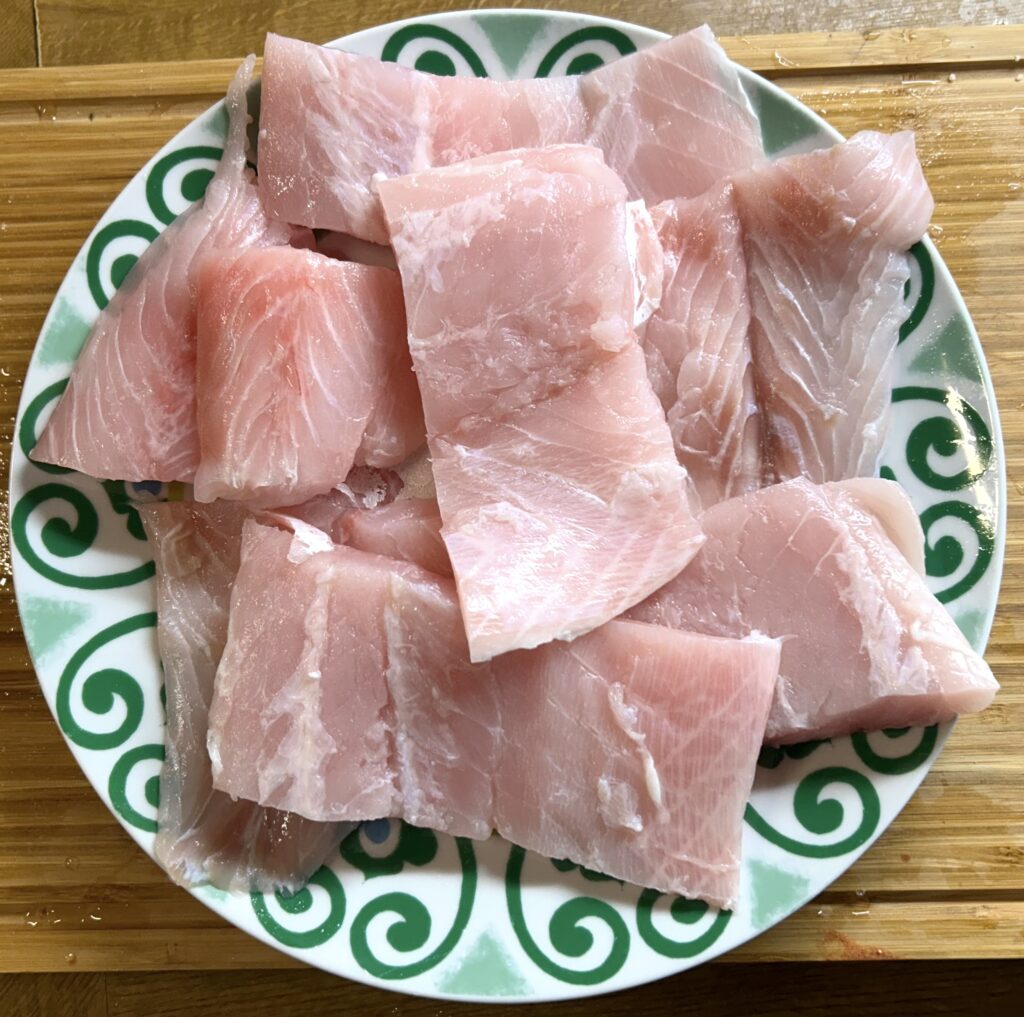 african perch fillet cut into slices