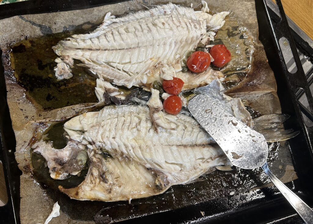 sea ​​bream cooked and already half cleaned