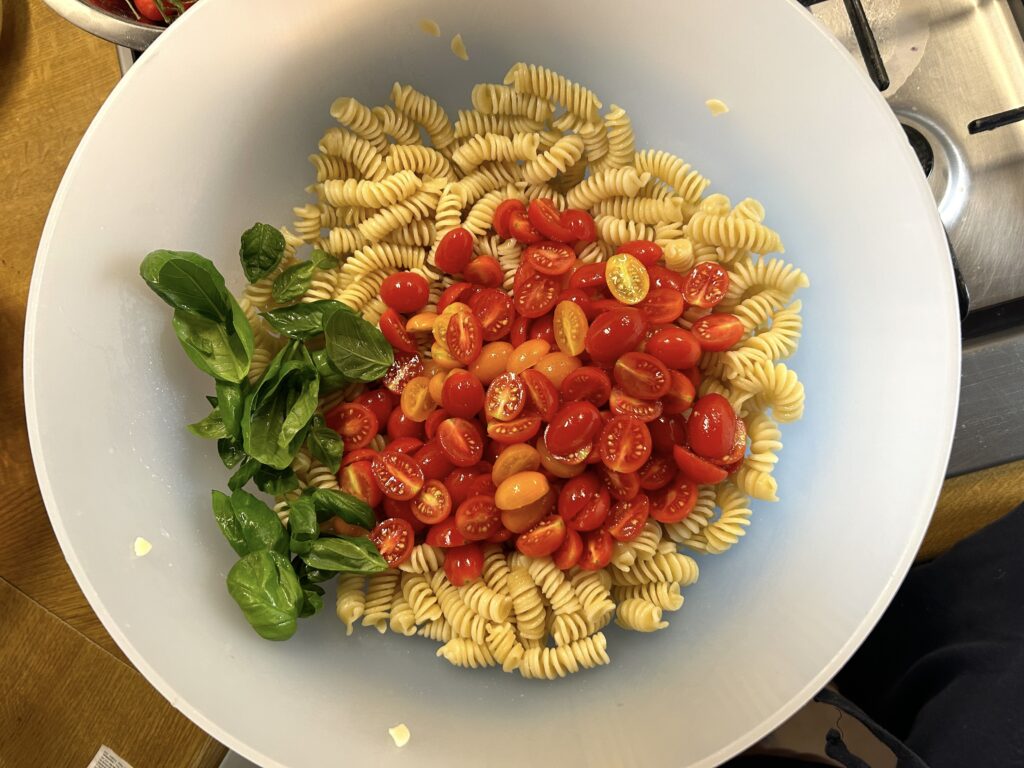 cold pasta, cherry tomatoes and basil