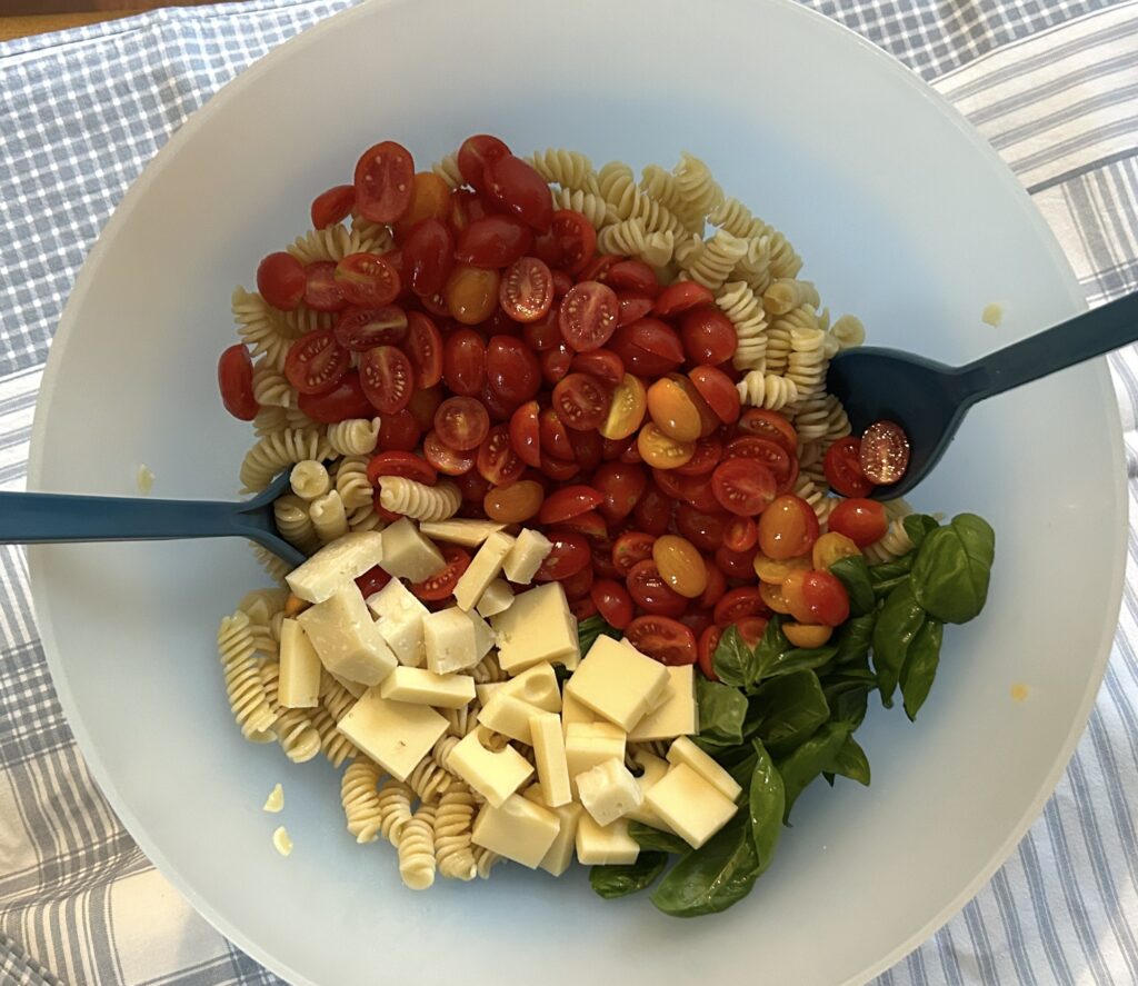 cold pasta, cherry tomatoes, basil and cheese