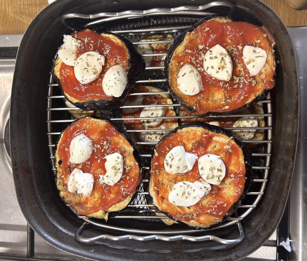 tomato puree, mozzarella and sprinkle some dried oregano