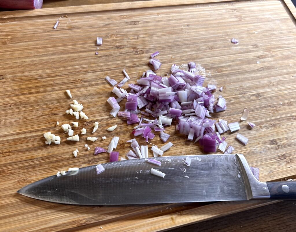 Cut an onion and a clove of garlic