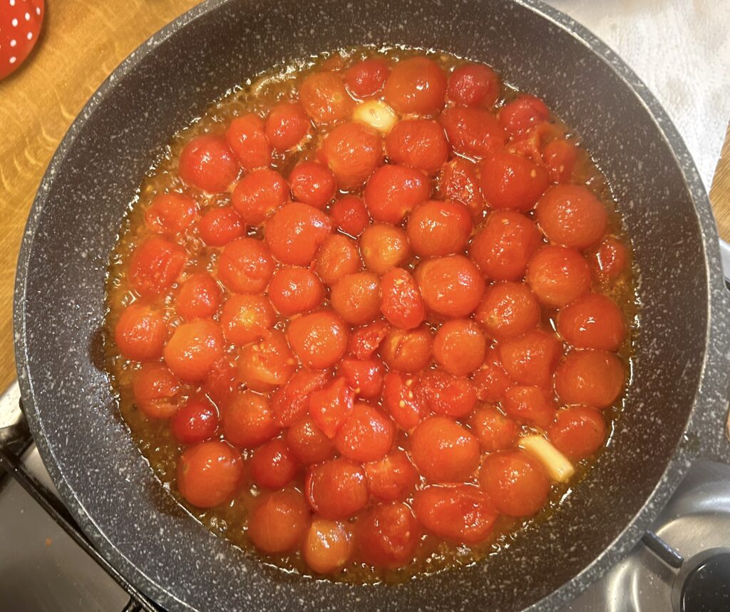 cook the cherry tomatoes in garlic and oil