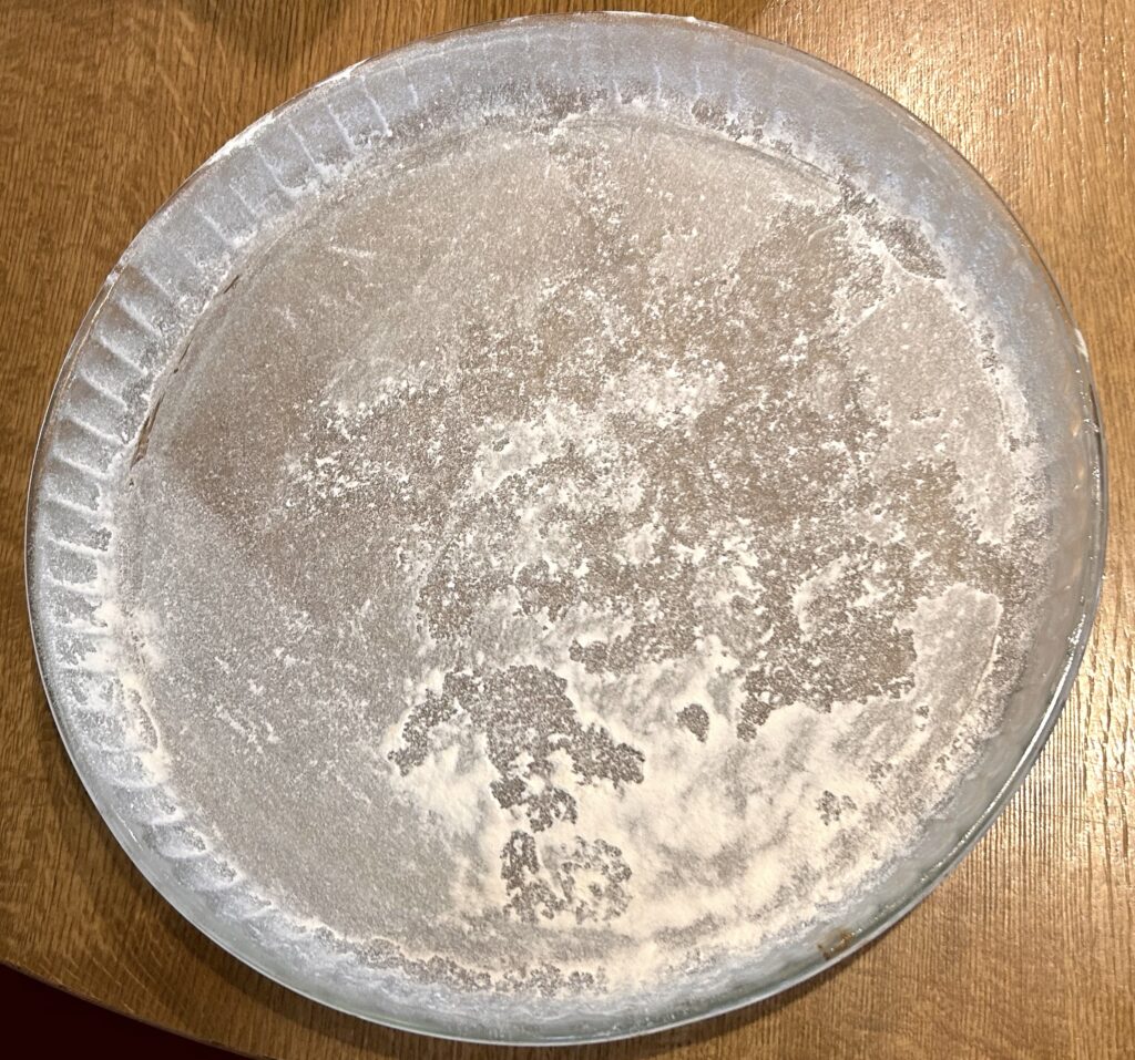 greased and floured baking tray