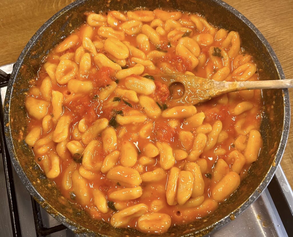 mix cavatelli and the sauce with the cherry tomatoes