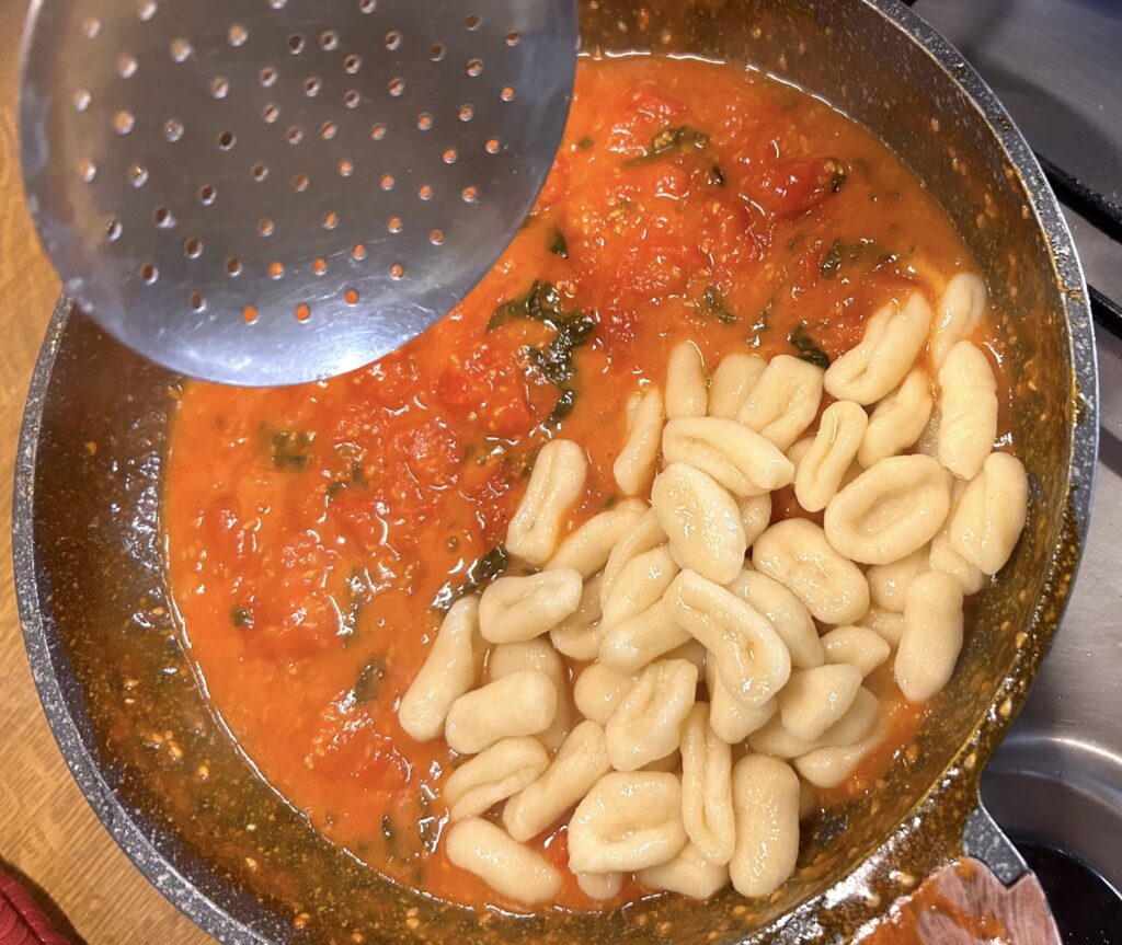 put cavatelli on top of our sauce with the cherry tomatoes