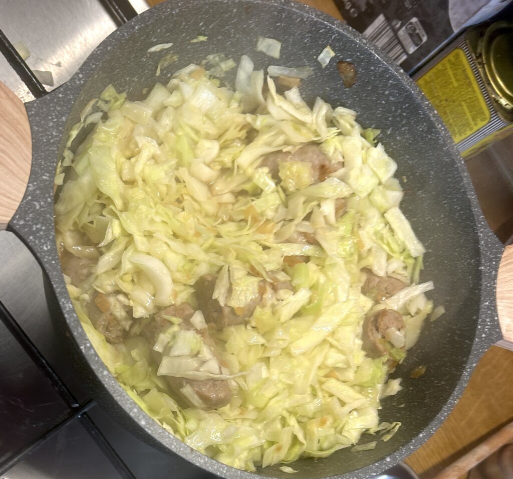 put cabbage over the sausage