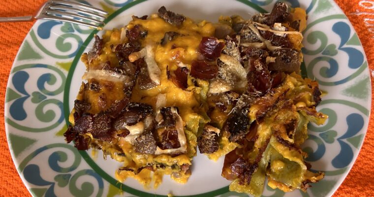 Bollognese lasagna with pumpkin and mushrooms and speck