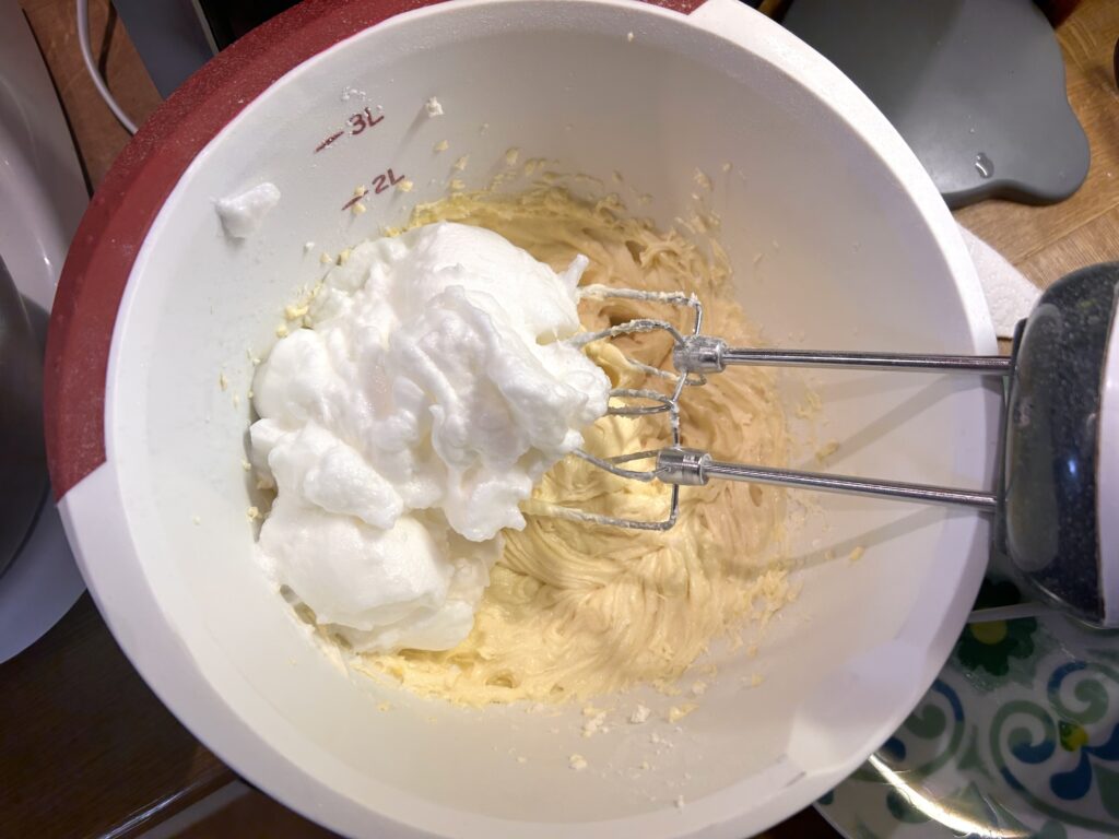 add the white of the whipped eggs