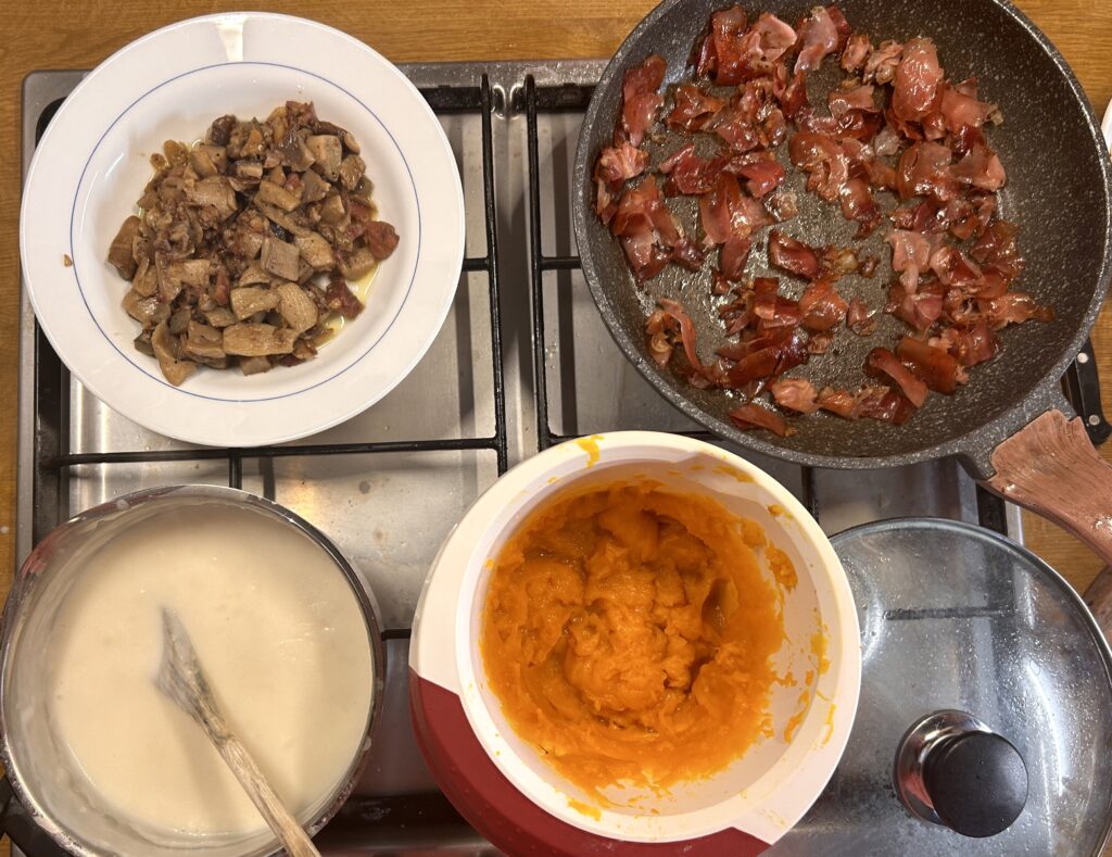 ingredients for lasagne bolognesi with pumpkin and mushrooms and speck